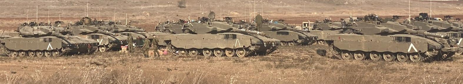 Image in @MarioNawfal's post: 🚨BREAKING: Israeli armor, including Merkava Mark III and IV tanks, and self-propelled artillery bat…