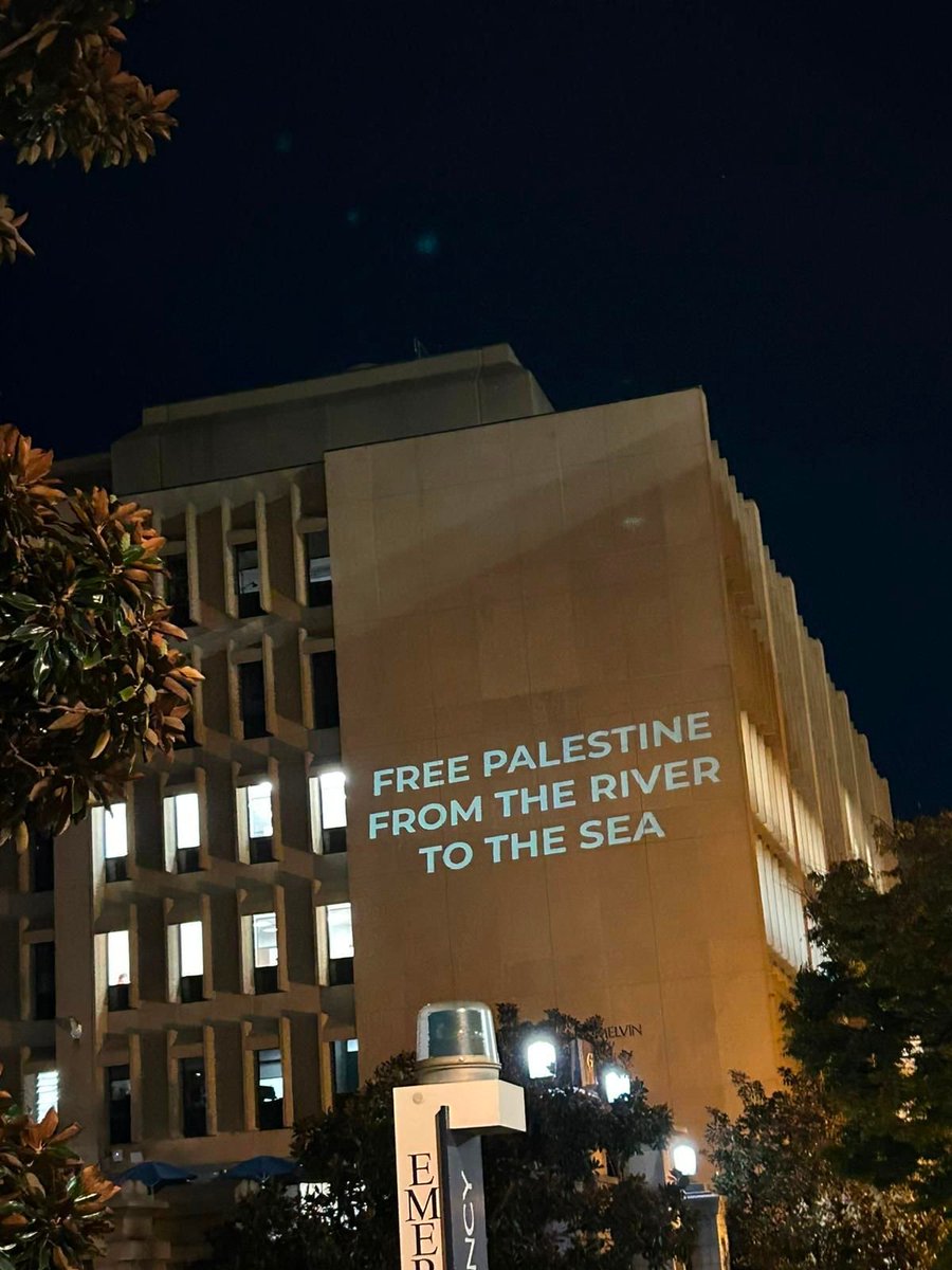 Image in @MarioNawfal's post: 🇺🇸🇵🇸 Students at the George Washington University project the following messages on the campus:
"G…