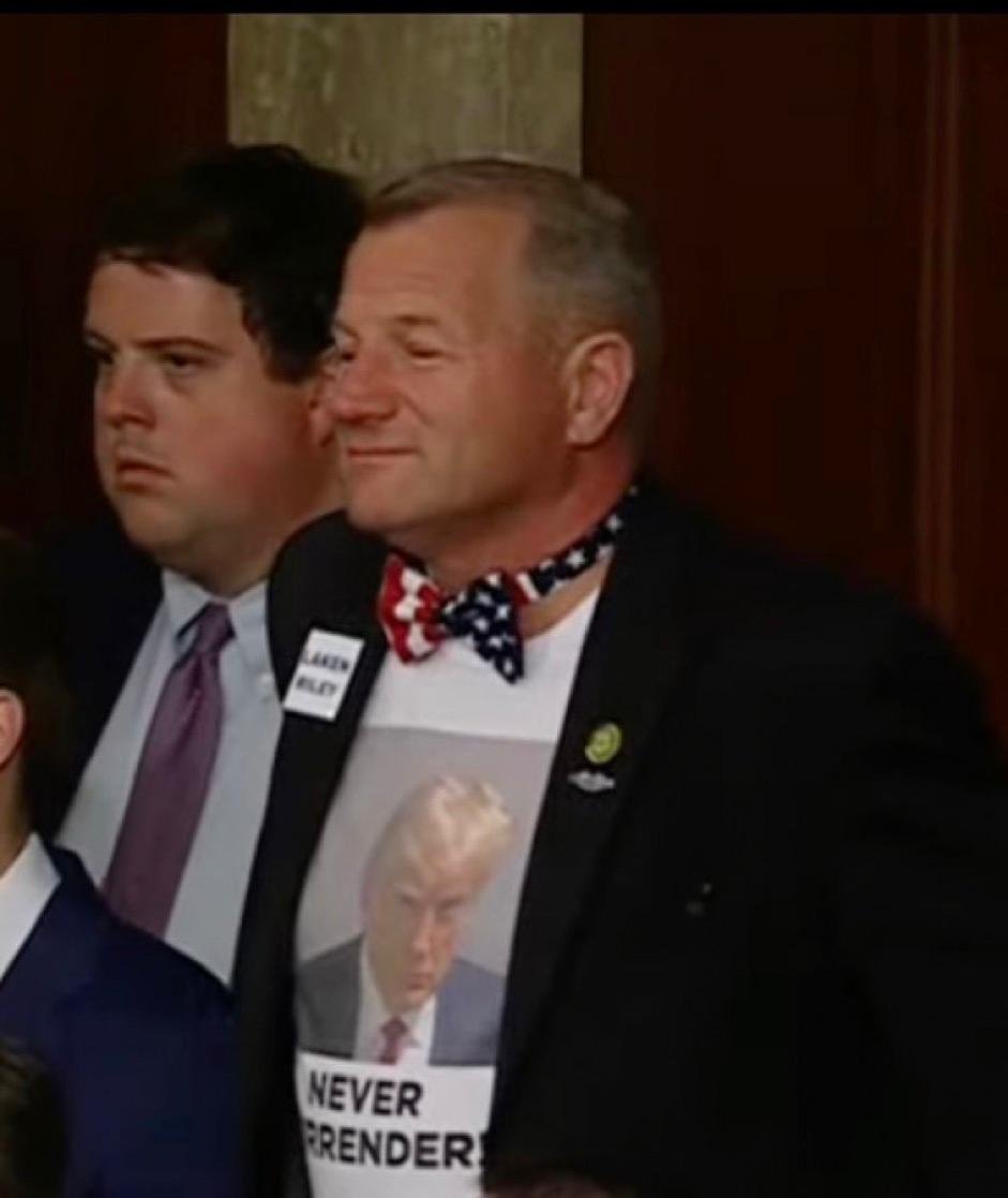 Image in @MarioNawfal's post: 🚨🇺🇸 TEXAS REPRESENTATIVE TROY NEHLS WEARS A "NEVER SURRENDER" TRUMP SHIRT https://t.co/V3wv9UAvBc