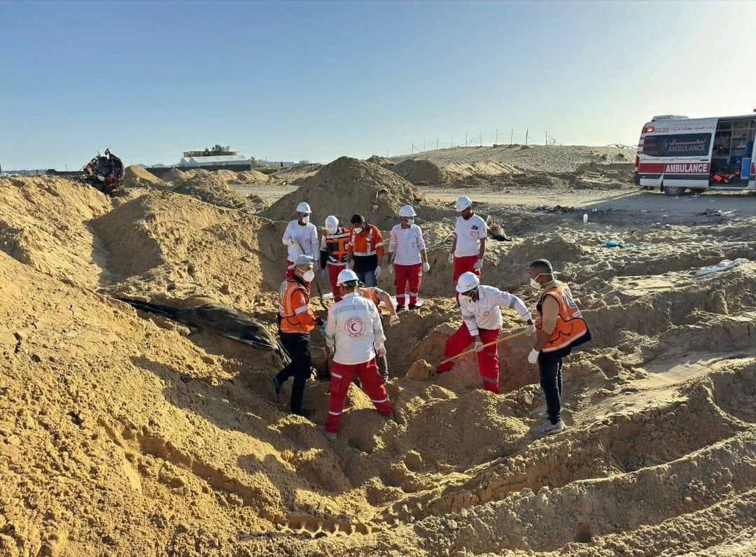 Image in @xIsraelExposedx's post: Footage has surfaced from the execution and burial site of 15 Red Crescent and civil defense worker…