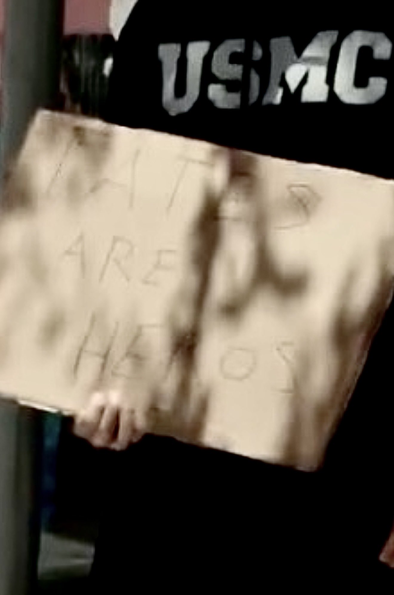Image in @sneako's post: Andrew Tate is lying from jail. Only one fan showed up outside with a sign and he spelled “heroes” …