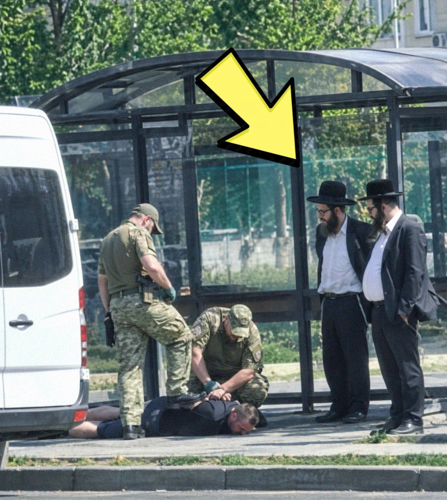 Image in @RabbiJeffx's post: This picture was just taken in Ukraine showing white men being forcibly dragged away to fight in Ze…