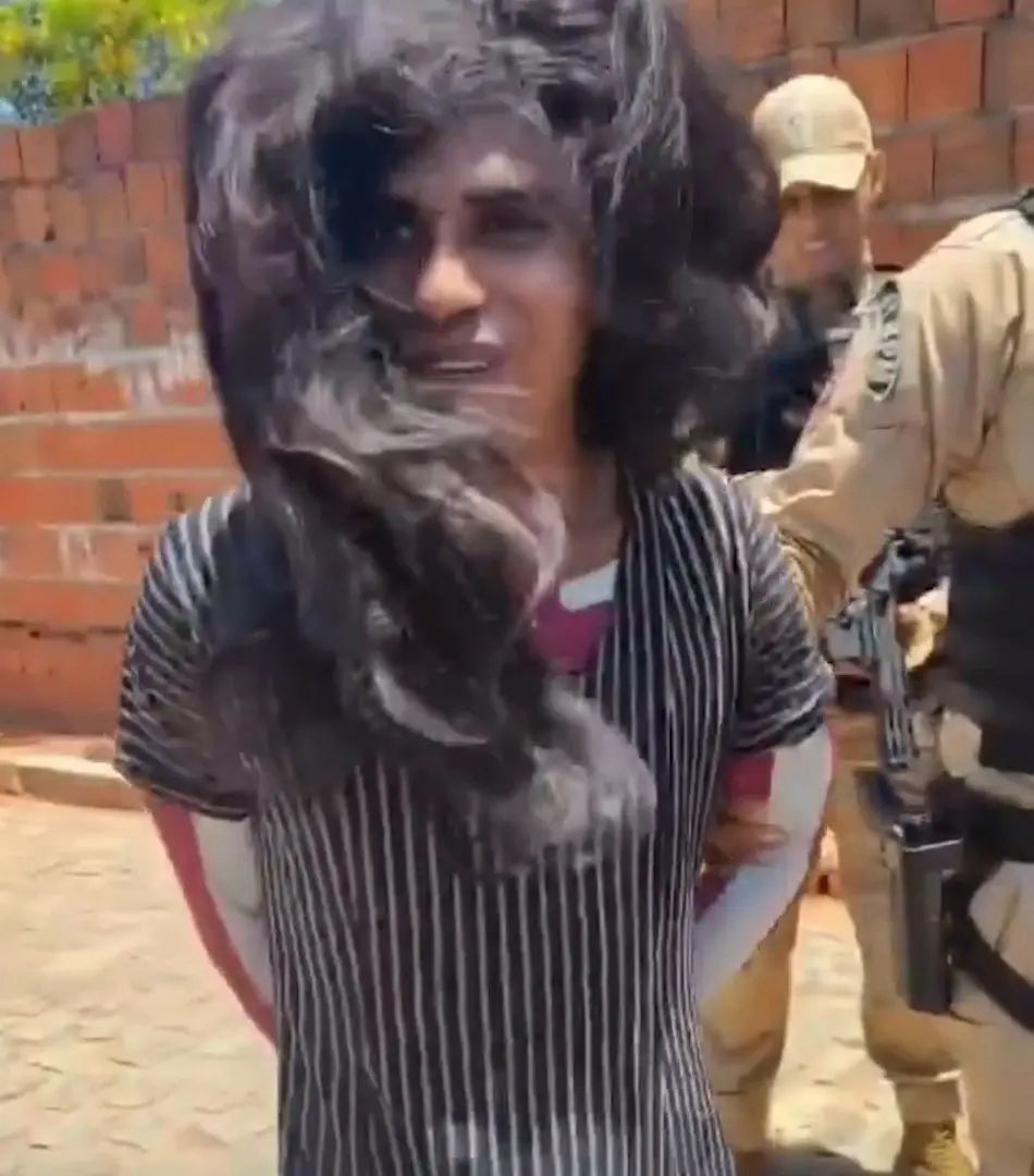 Image in @MarioNawfal's post: 🇧🇷 PEEKABOO: It took one officer, one doubt, and one sharp tug on a fake wig to finally end an 80-b…